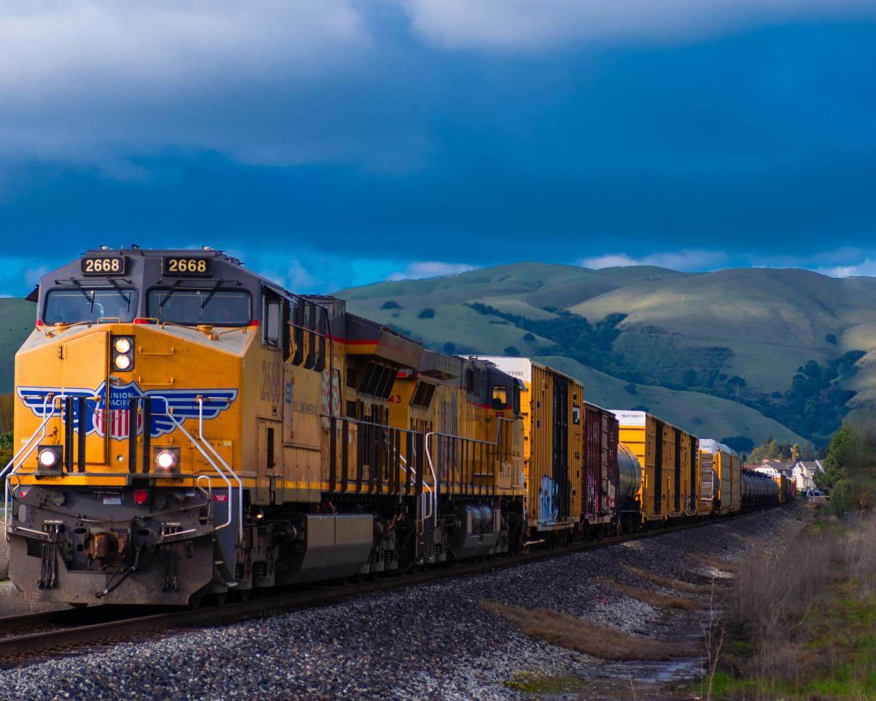 yellow and black train near mountain